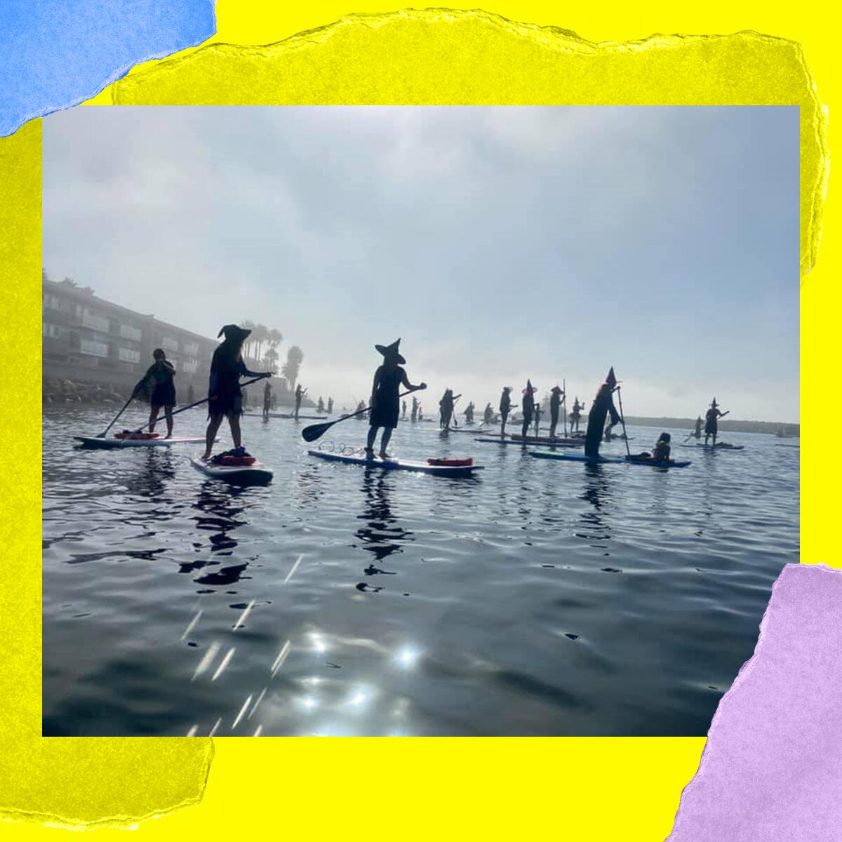 People in pointed hats on paddle boards.