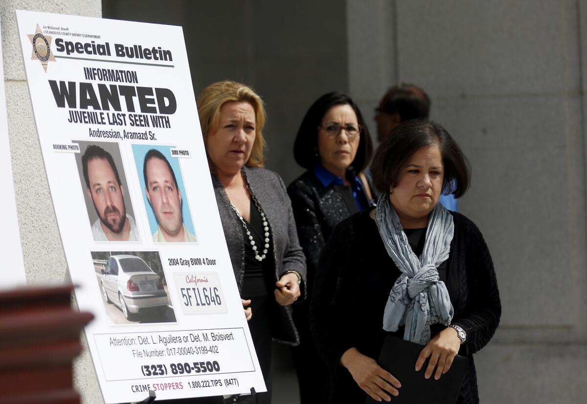 Ana Estevez, center, the mother of a missing South Pasadena boy, asks for the public's help in finding her son at a news conference last month. Aramadz Andressian Jr. has been missing since April 22.