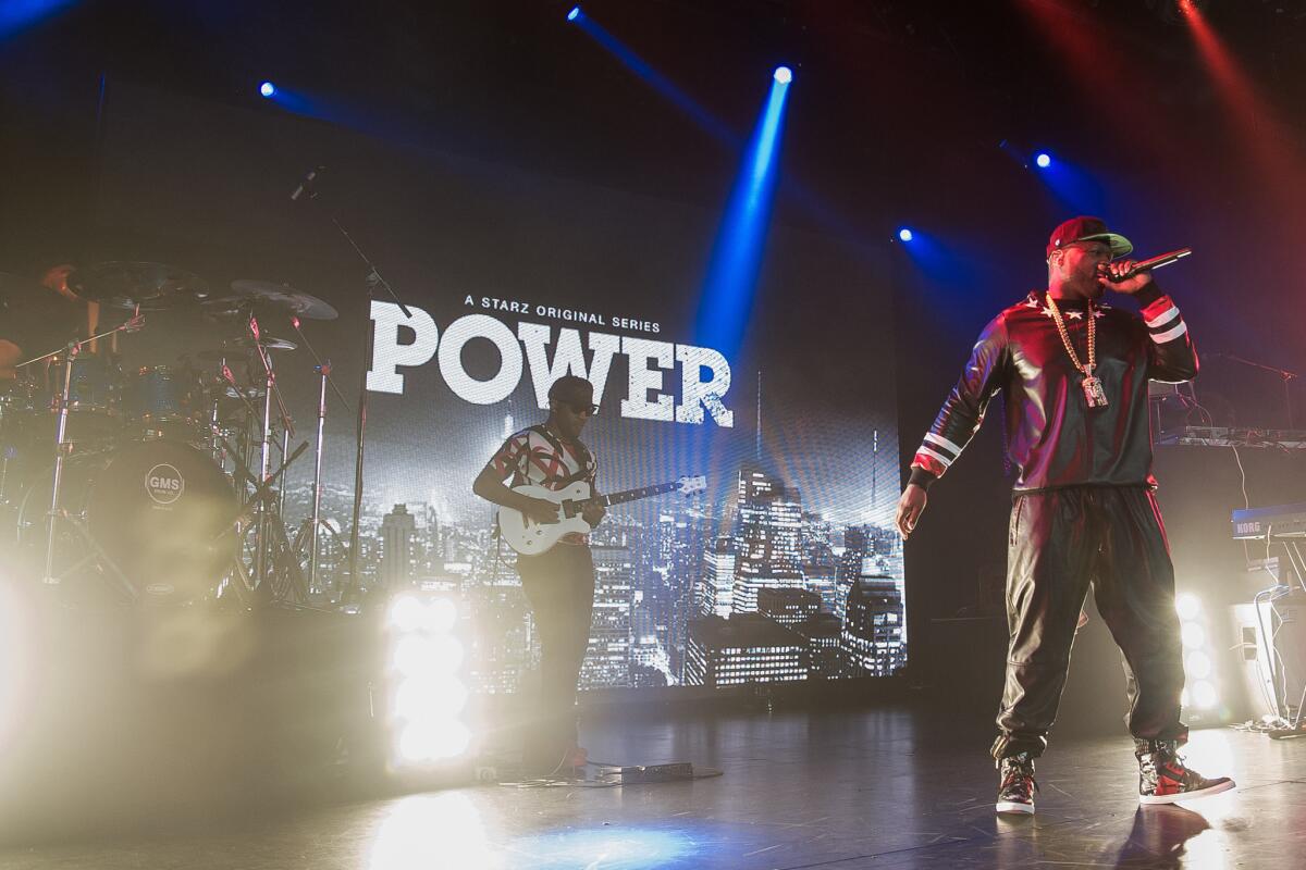 AT&T and premium network Starz hammered out a new distribution deal late Friday, ensuring that millions of viewers will be able to watch such shows as "Power," which stars Curtis "50 Cent" Jackson, shown here performing at the "Power" Season 2 launch party in New York.