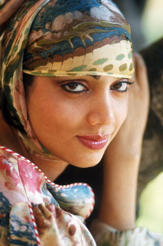 A woman in colorful clothing.