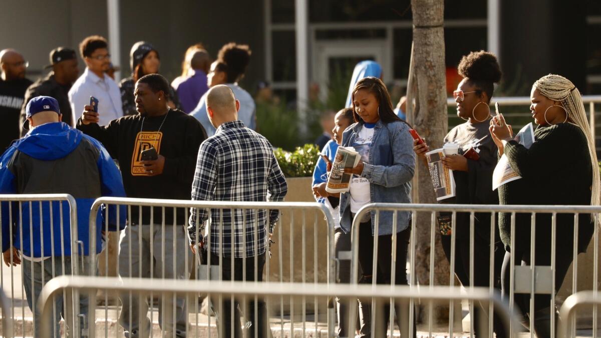 Memorial attendees arrive at Staples Center on Thursday to honor slain rapper Nipsey Hussle.