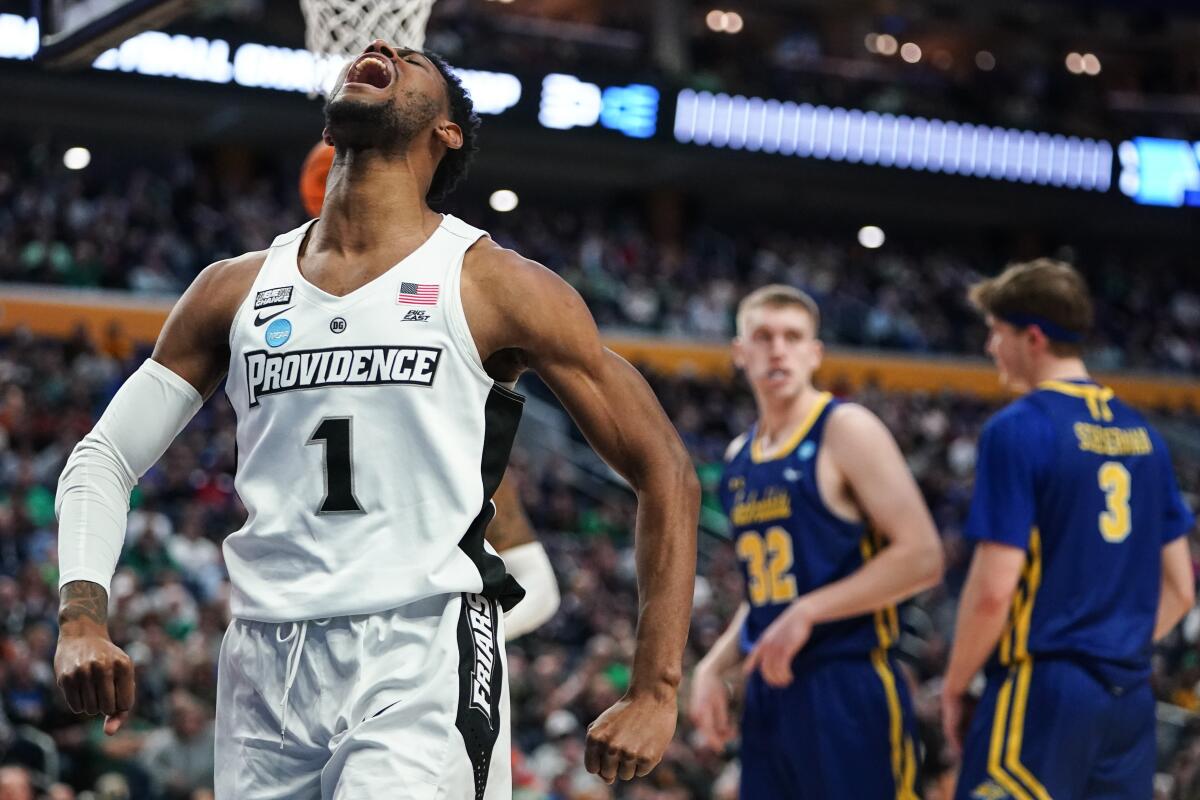 Providence's Al Durham celebrates after drawing a foul while scoring during the second half against South Dakota State.