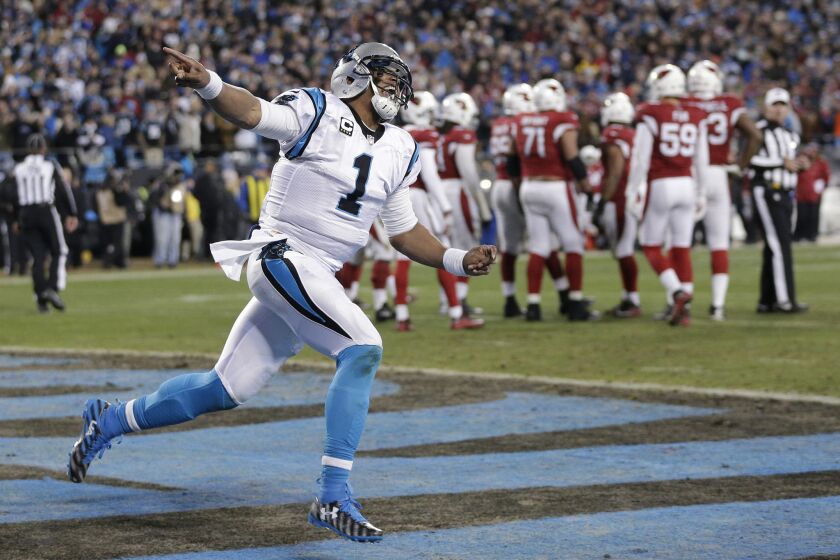 Panthers quarterback Cam Newton celebrates after scoring on a one-yard run against the Cardinals during the NFC Championship game on Jan. 24.