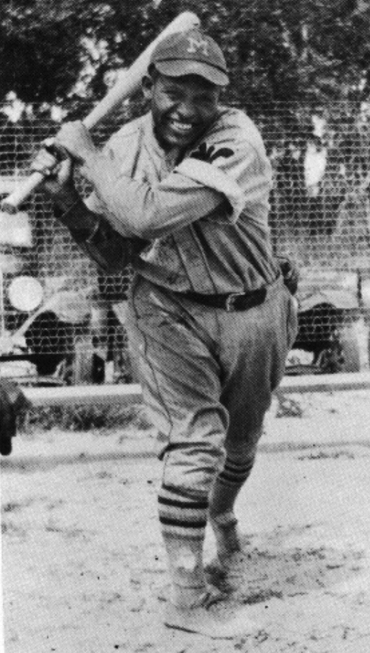 A. Hallie Harding, SS/2B/3B, is shown in the uniform of the Kansas City Monarchs. 