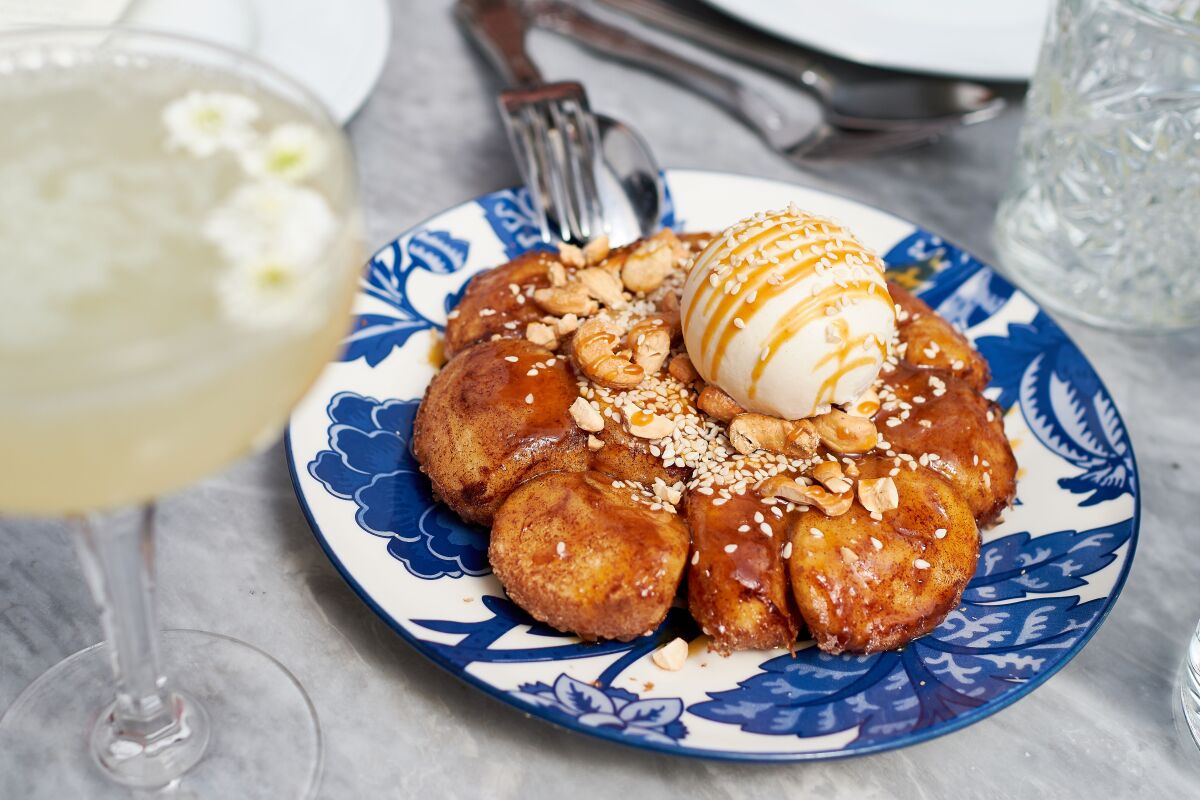 Fresh-baked, pull-apart monkey bread, one of the more unusual brunch items at Herb & Wood restaurant in Little Italy.