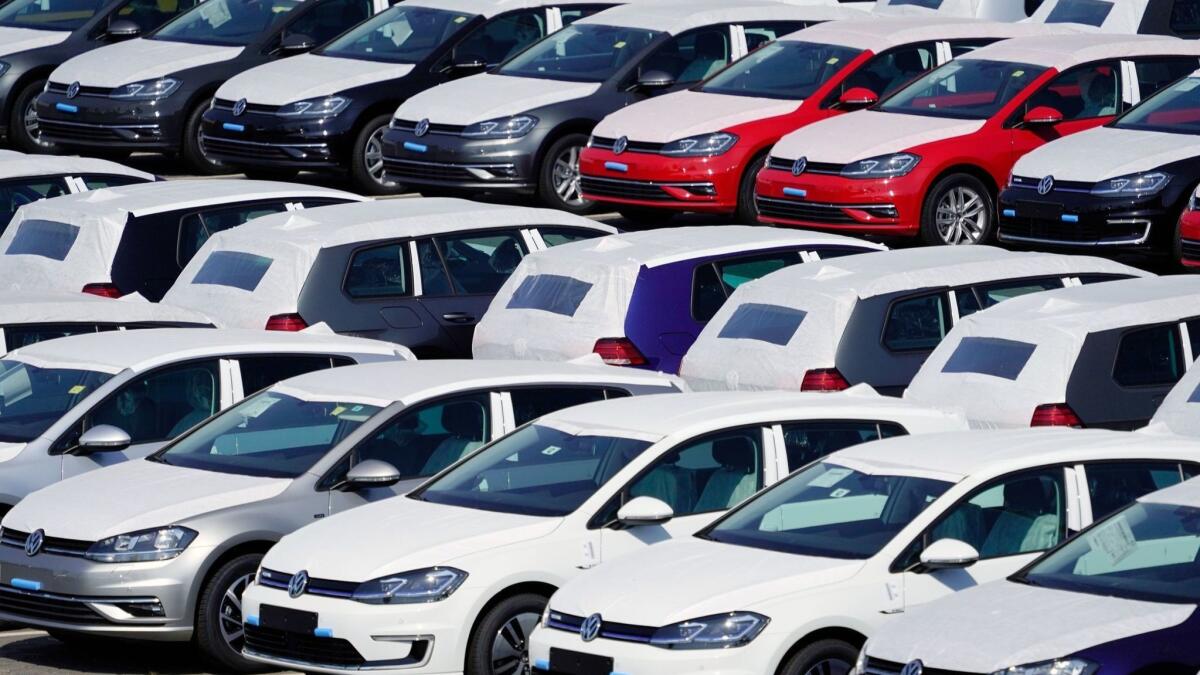 Volkswagen cars are parked near the Berlin Brandenburg Airport in August.