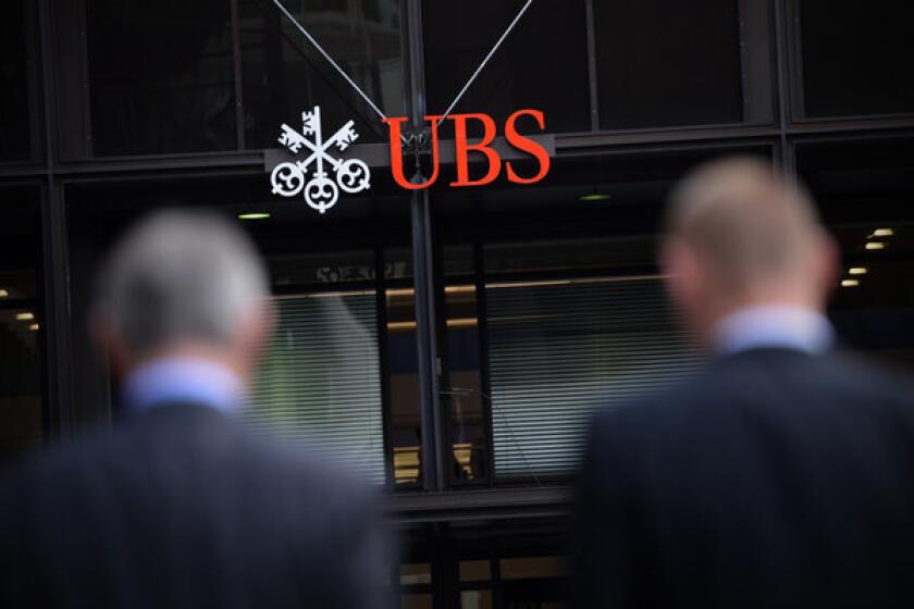 The offices of Swiss bank UBS in London. UBS said it will cut 10,000 workers by 2015.