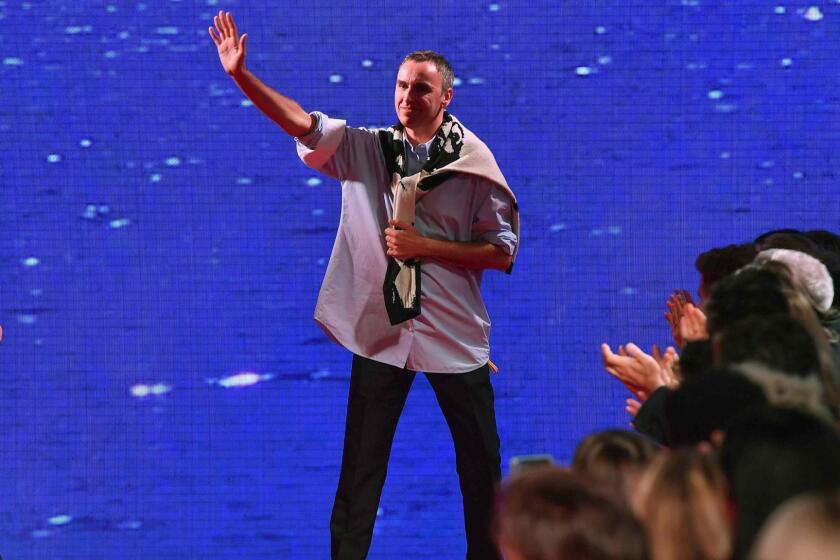 (FILES) In this file photo taken on September 11, 2018 Belgian fashion designer Raf Simons waves to his guests on the runway at the Calvin Klein 205W39NYC Spring 2019 Men's and Women's runway show during New York Fashion Week in New York City. - American fashion label Calvin Klein announced March 6, 2019, it is closing its high-end runway division as part of a restructuring by parent company PVH. "I can confirm that the Calvin Klein 205W39NYC business is closing," the company told AFP. PVH brought in Belgian designer Raf Simons from Dior in 2016 to revitalize the brand, which had stagnated since the departure of its namesake New Yorker founder in 2002. (Photo by Angela Weiss / AFP)ANGELA WEISS/AFP/Getty Images ** OUTS - ELSENT, FPG, CM - OUTS * NM, PH, VA if sourced by CT, LA or MoD **