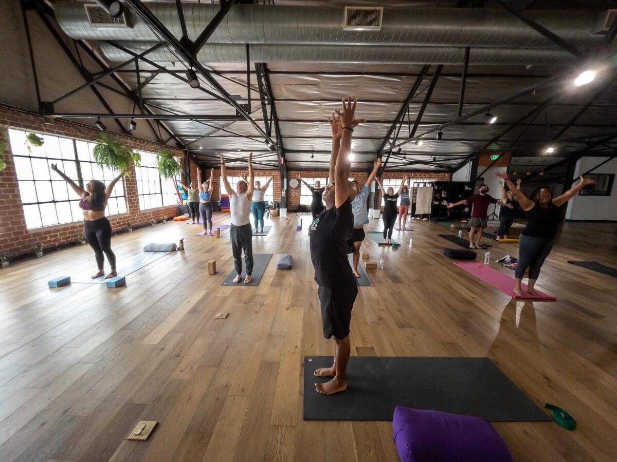 Jonie Cole Thomas, co-owner and instructor, leads a class at the Tree Yoga Cooperative. 