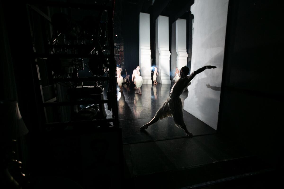 A swan prepares to enter the stage during a performance of Matthew Bourne's "Swan Lake" at the Ahmanson Theatre.