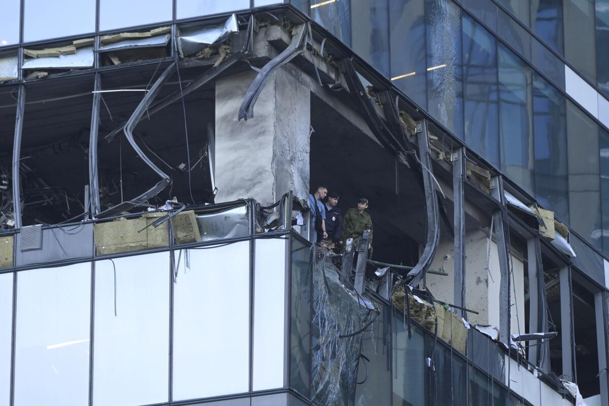 Windows and walls of a skyscraper are damaged