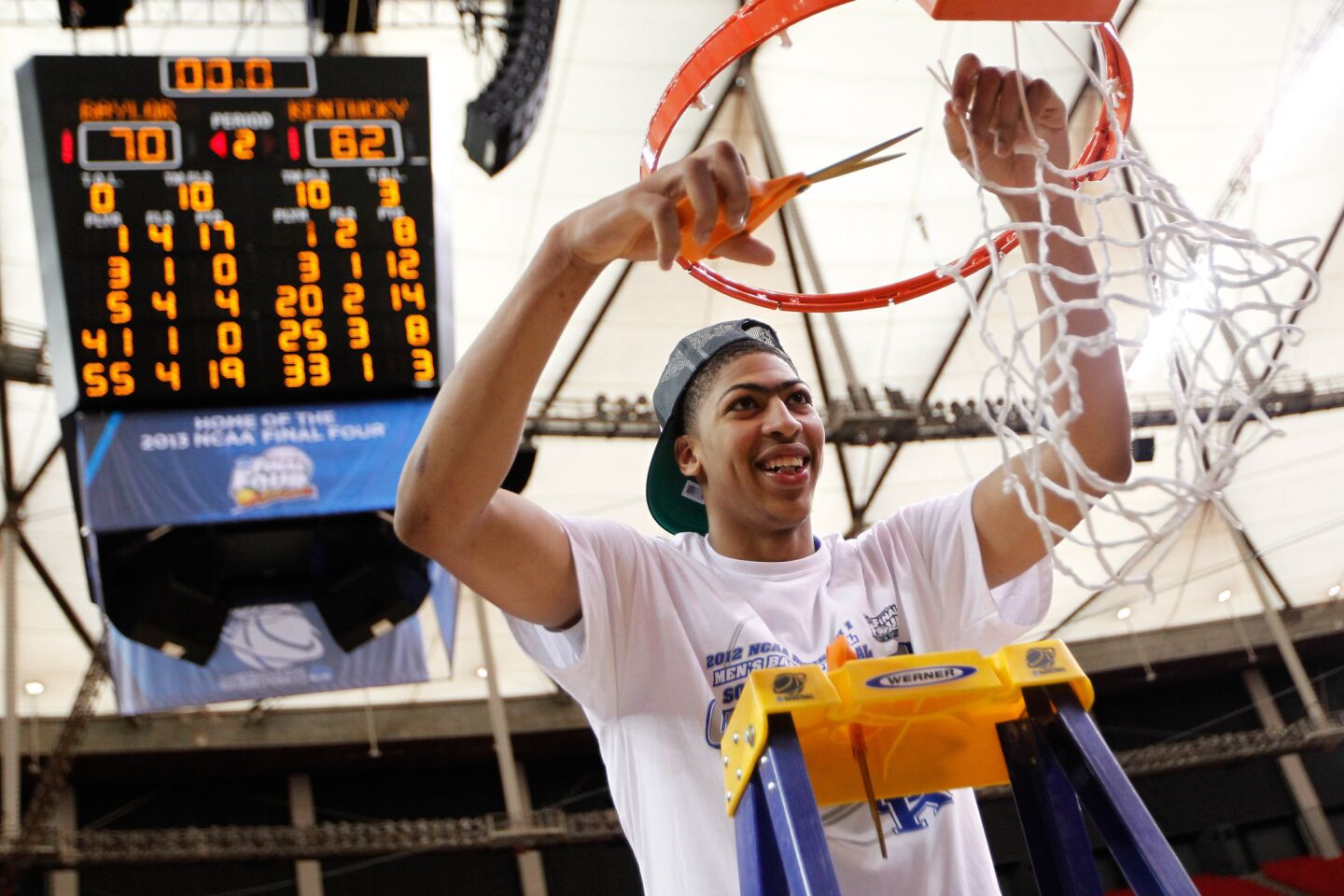 Anthony Davis cuts down the net after Kentucky defeated the Baylor 82-70 in the NCAA tournament South Regional final on March 25, 2012, in Atlanta.