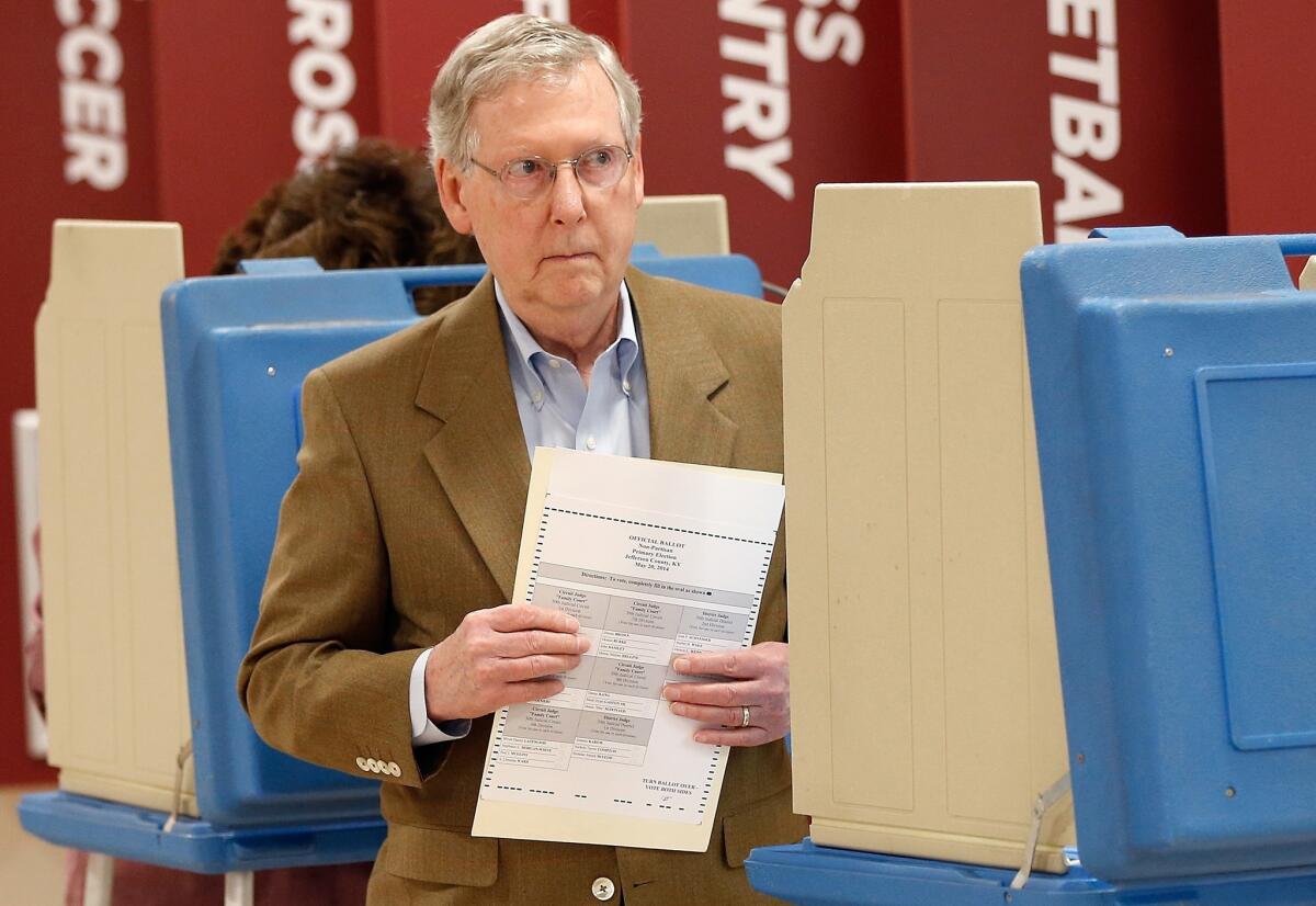 Senate Republican Leader Mitch McConnell (R-Ky.) votes in the state Republican primary at Bellarmine University in Louisville.