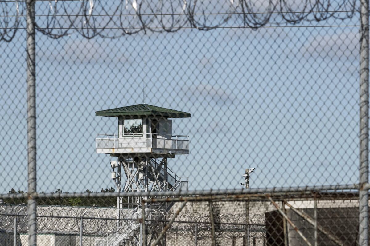 FILE - In this April 16, 2018, photo, a guard tower stands above the Lee Correctional Institution, a maximum security prison in Bishopville, S.C. South Carolina has given the greenlight to firing-squad executions. The method was codified into state law last year after a decade-long pause in carrying out the death sentence over the state's inability to procure lethal injection drugs. State prison officials said Friday, March 18, 2022, that renovations have been completed on the death chamber in Columbia to allow for a firing squad. (AP Photo/Sean Rayford, File)