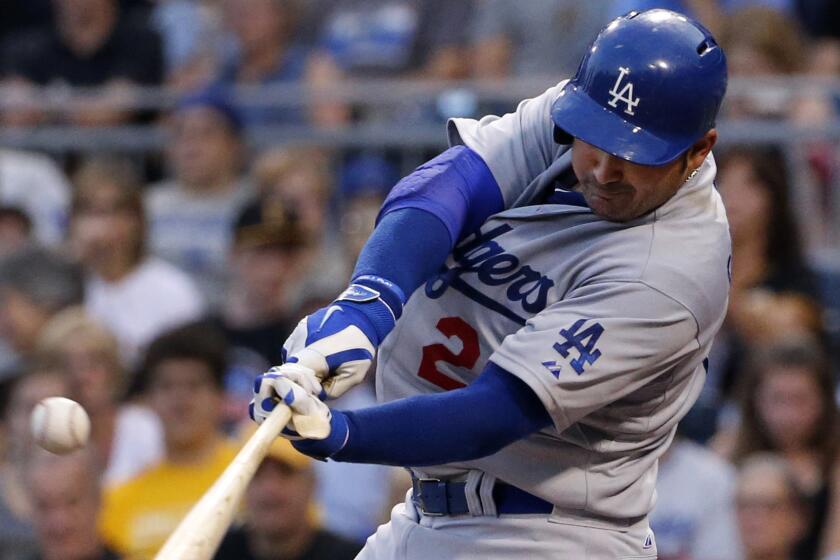 Dodgers first baseman Adrian Gonzalez singles in a run during the fourth inning of the Dodgers' 5-2 win over the Pittsburgh Pirates on Monday.