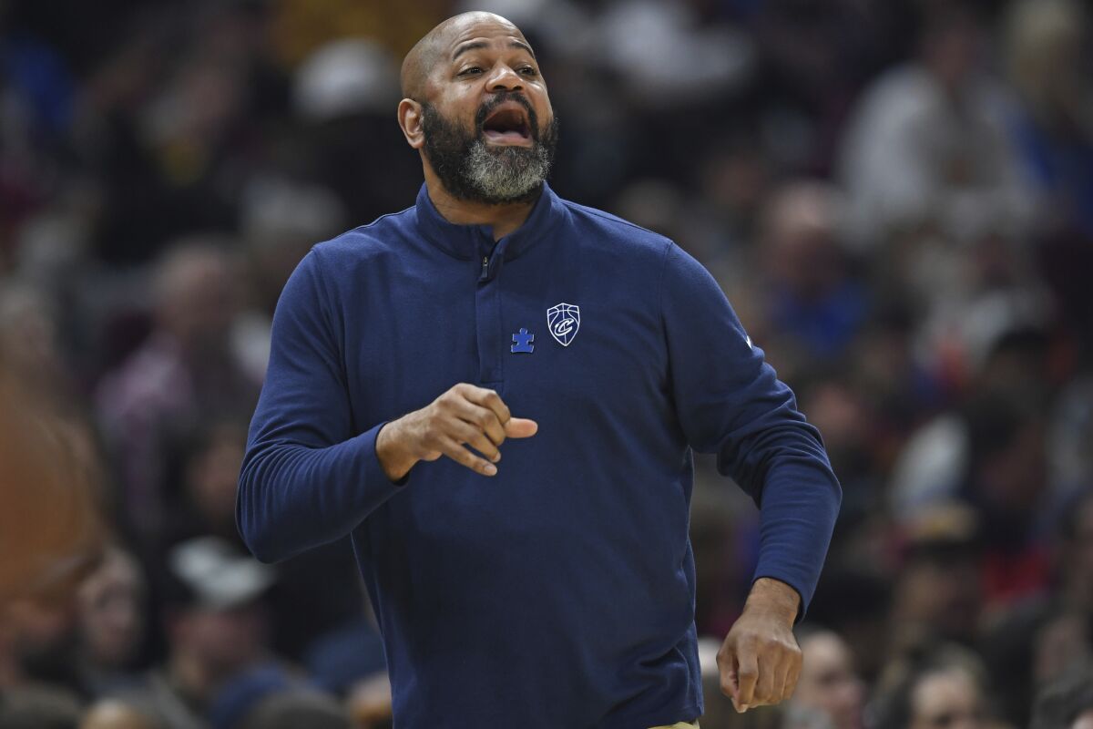 Cleveland Cavaliers head coach J.B. Bickerstaff shouts from the bench in the first half of an NBA basketball game against the Philadelphia 76ers, Sunday, April 3, 2022, in Cleveland. (AP Photo/David Dermer)