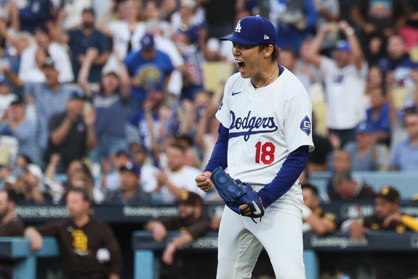 LOS ANGELES, CALIFORNIA - OCTOBER 11: Yoshinobu Yamamoto #18 of the Los Angeles Dodgers.