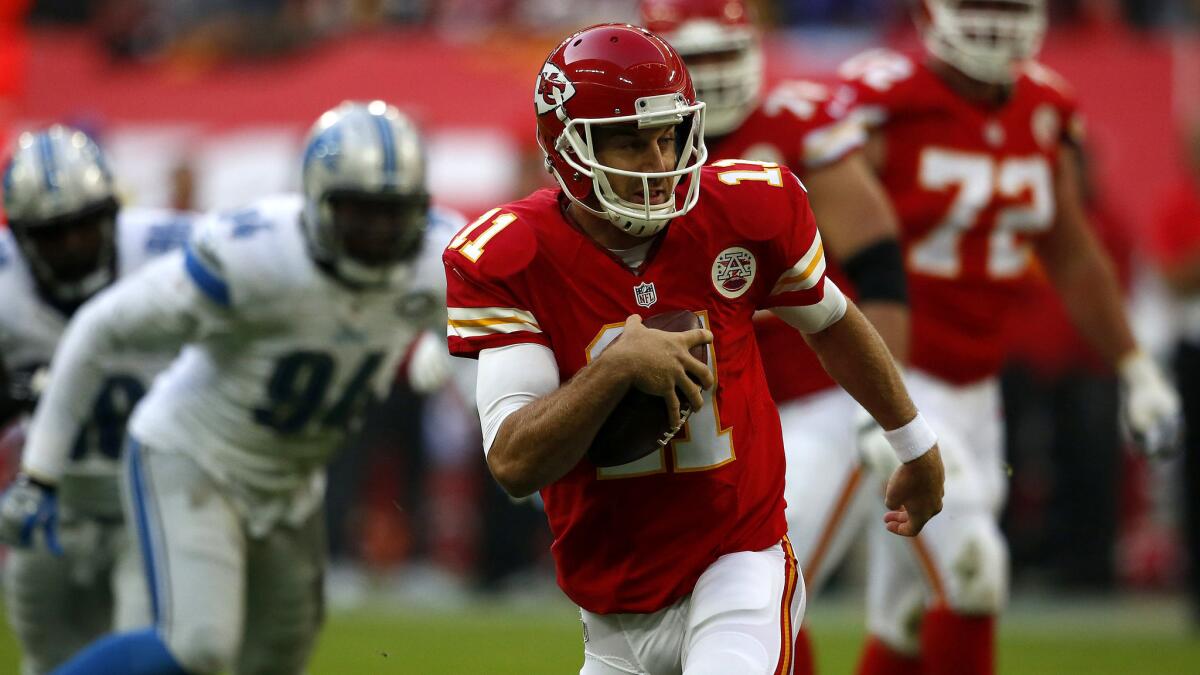 Chiefs quarterback Alex Smith scrambles for a big gain against the Lions on SUnday at Wembley Stadium.