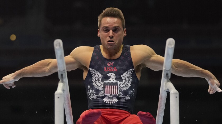 Sam Mikulak competes on the parallel bars during the U.S. Olympic trials June 26, 2021, in St. Louis.