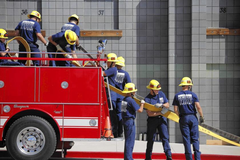 Los Angeles Fire Department recruits train at a facility in Panorama City. As part of Thursday's announcement, Garcetti said a new training class scheduled to begin later this year has been canceled.