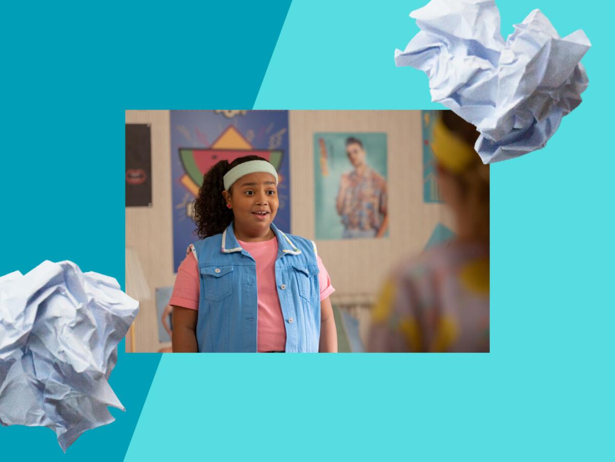 A tween girl wearing a headband looks surprised and delighted.