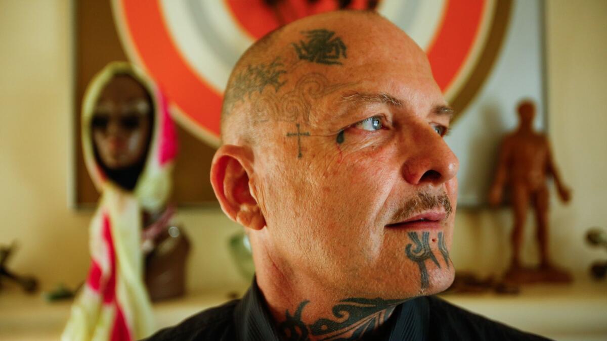Ron Athey stands for a portrait in his apartment in Silver Lake.