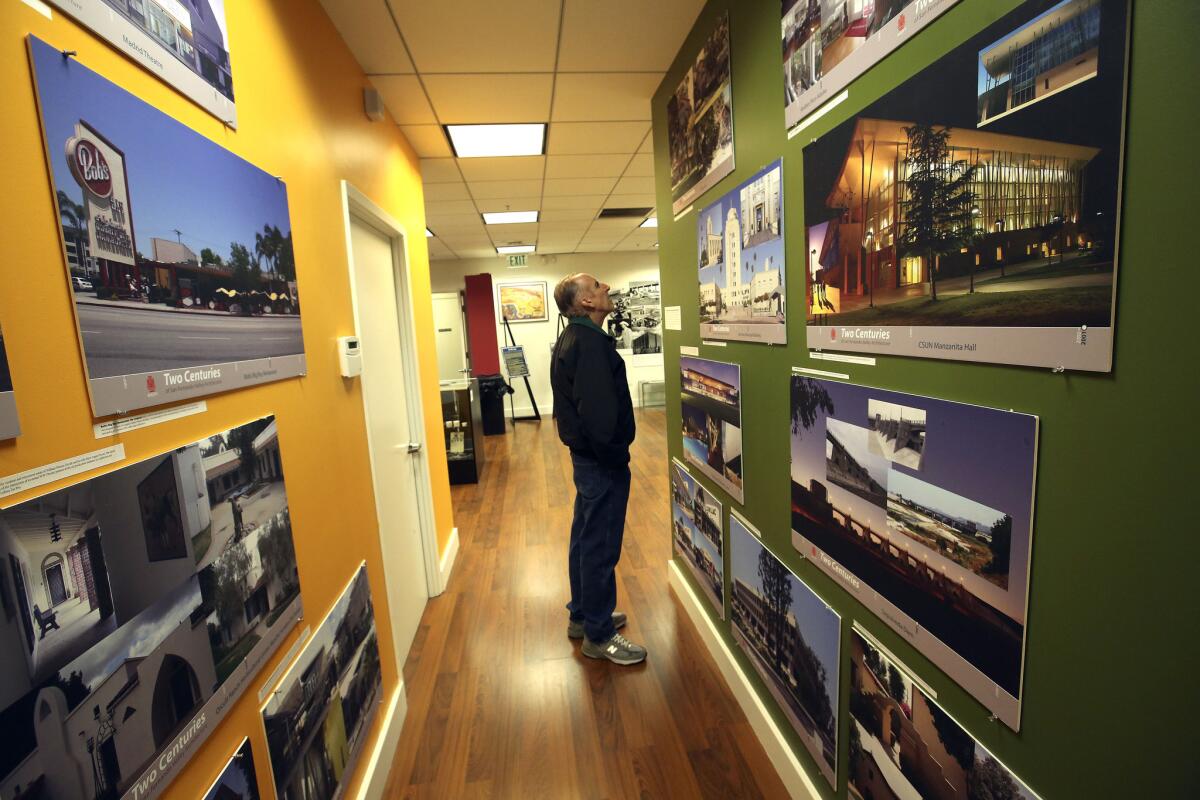 David Orenstein of Woodland Hills examines images of Valley architecture at the new Northridge site.