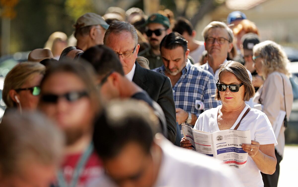 Voters in Manhattan Beach wait in line to vote in the primary election March 3. 