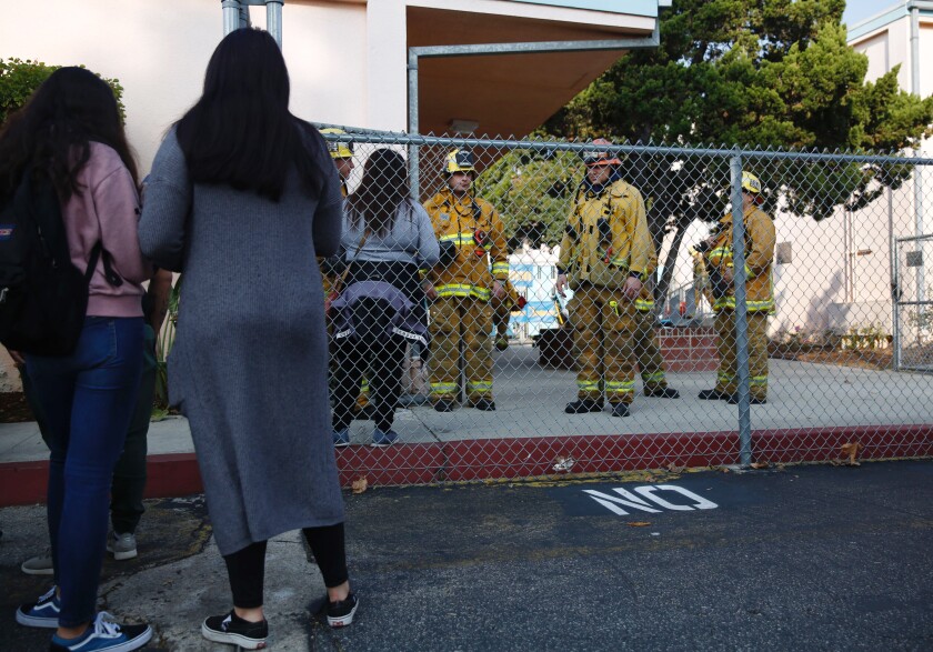 Parents wait outside Park Avenue Elementary School in Cudahy