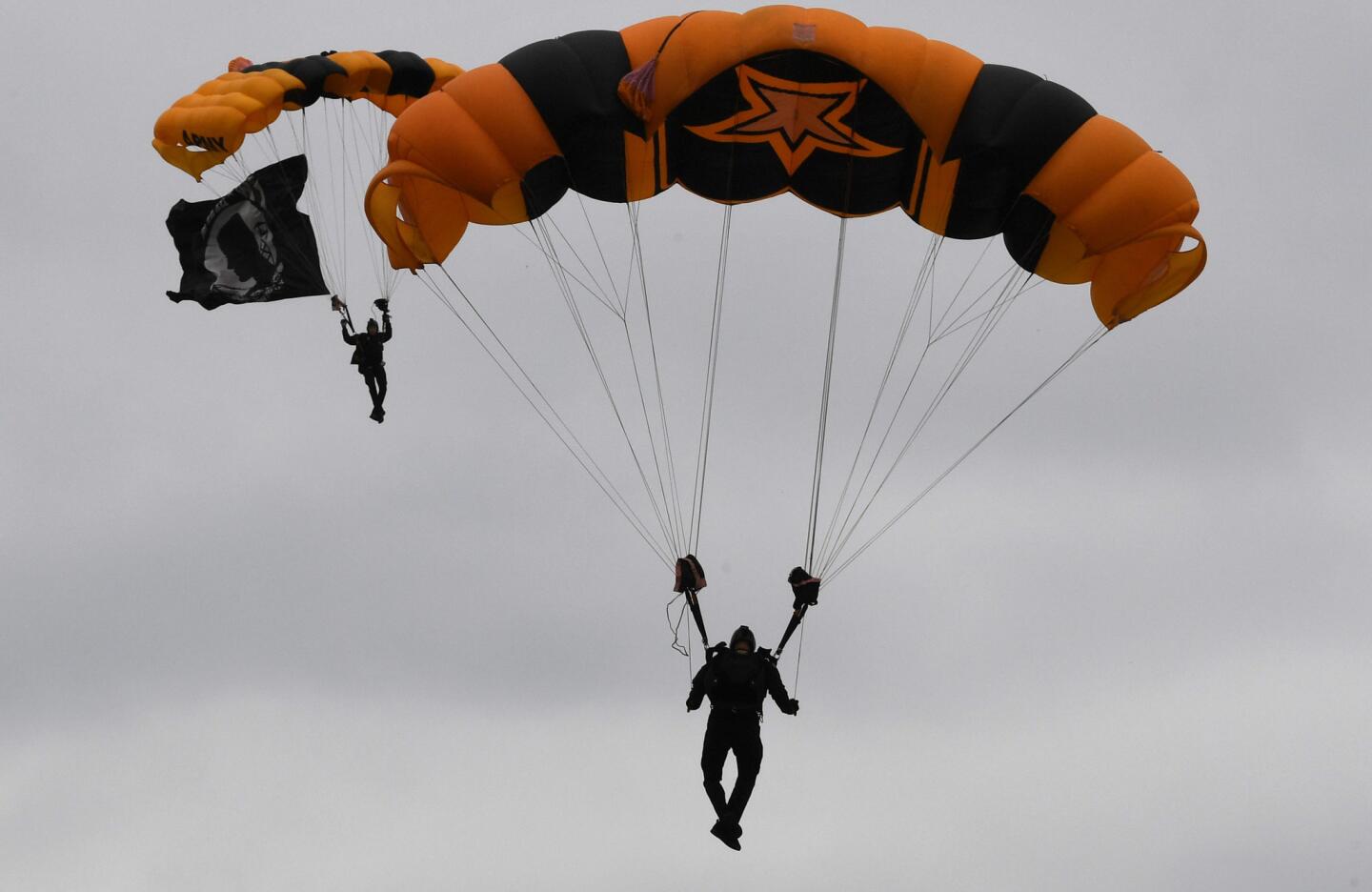 The U.S. Army Golden Knights land in the Pimlico infield as part of Preakness festivities. (Jerry Jackson/Baltimore Sun)