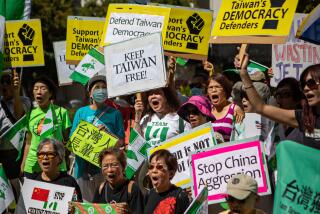 LOS ANGELES, CA - AUGUST 14: Taiwanese Americans gather in front of the Chinese Consulate General holding signs and chanting, "Keep Taiwan Free" and demanding the US governments continued support of Taiwan on Sunday, Aug. 14, 2022 in Los Angeles, CA. (Jason Armond / Los Angeles Times)