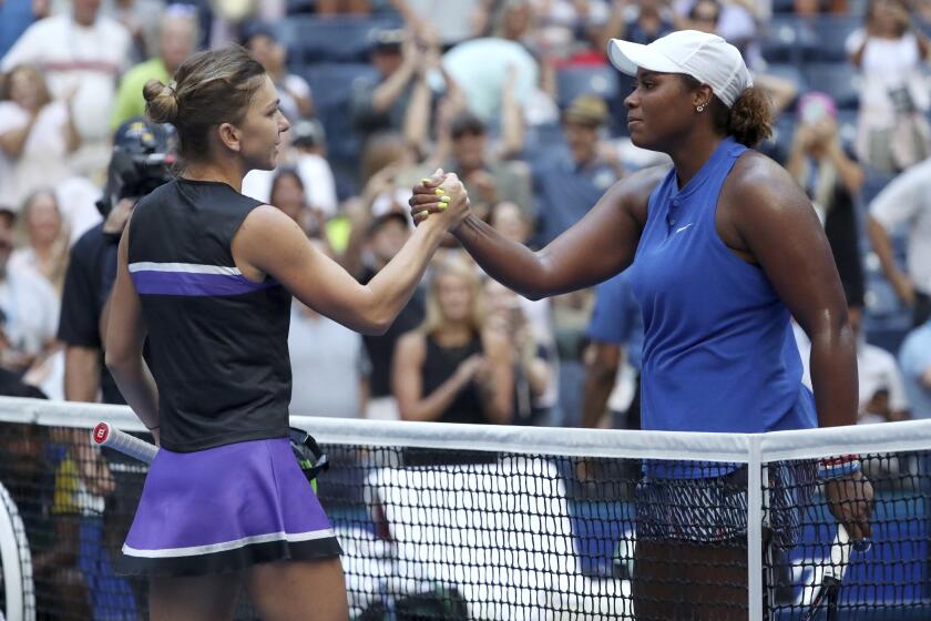 Simona Halep, left, of Romania, congratulates Taylor Townsend, of the United States, after Townsend won their second round match of the US Open tennis championships Thursday, Aug. 29, 2019, in New York. (AP Photo/Kevin Hagen)