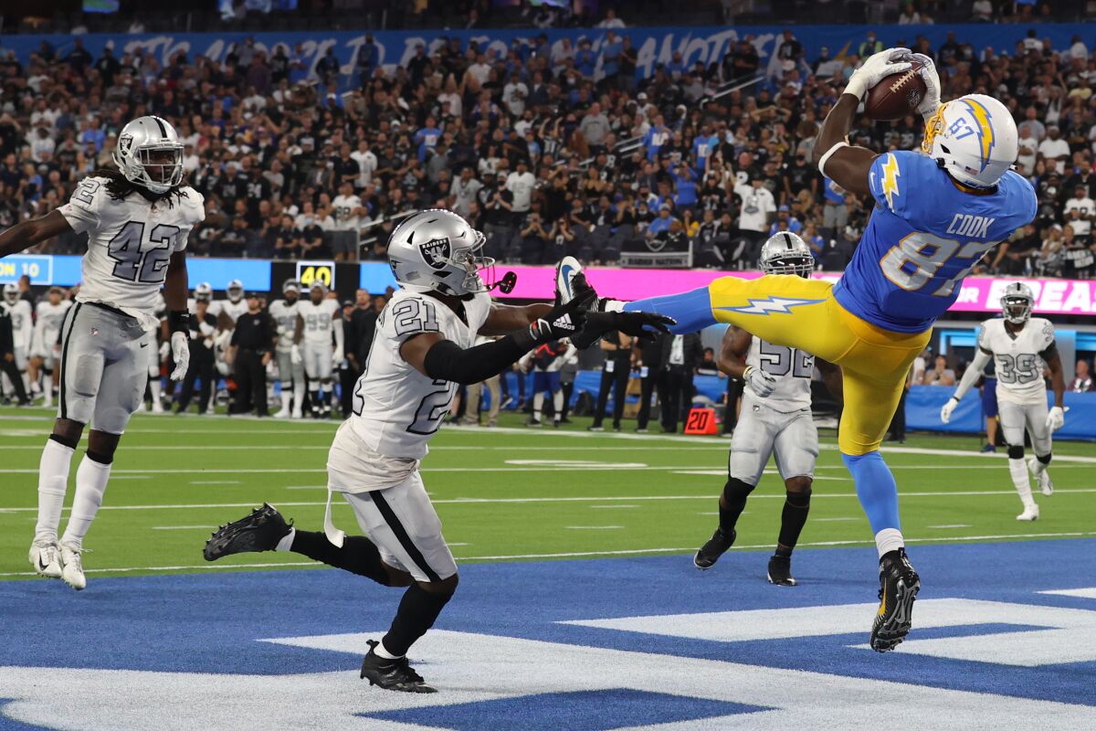 Jared Cook of the Los Angeles Chargers scores a touchdown against the Las Vegas Raiders during the second quarter .