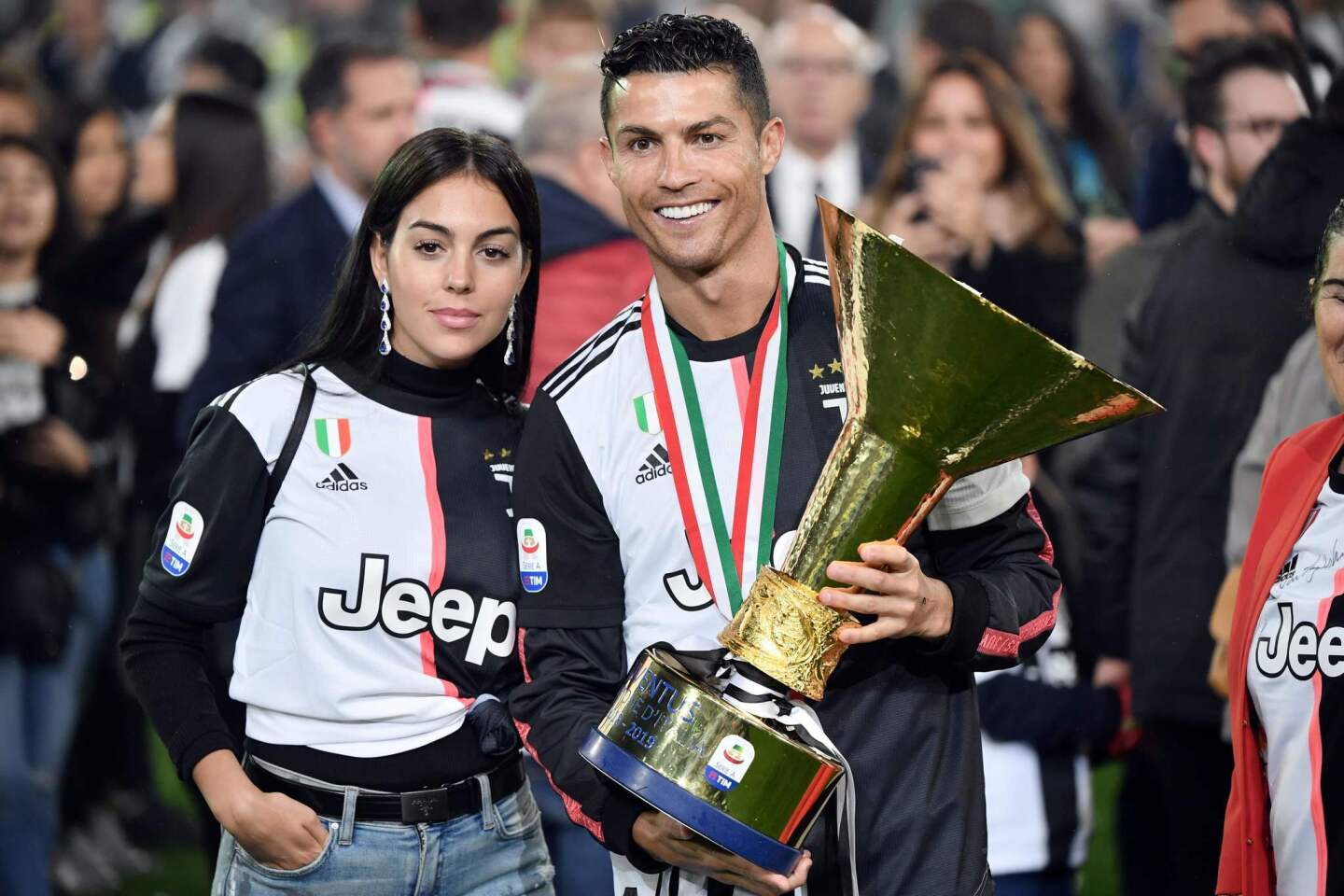 Juventus' Portuguese forward Cristiano Ronaldo holds the Italian Champion's trophy next to his wife Georgina at the end of the Italian Serie A football match Juventus vs Atalanta on May 19, 2019 at the Allianz stadium in Turin. (Photo by Marco Bertorello / AFP)MARCO BERTORELLO/AFP/Getty Images ** OUTS - ELSENT, FPG, CM - OUTS * NM, PH, VA if sourced by CT, LA or MoD **