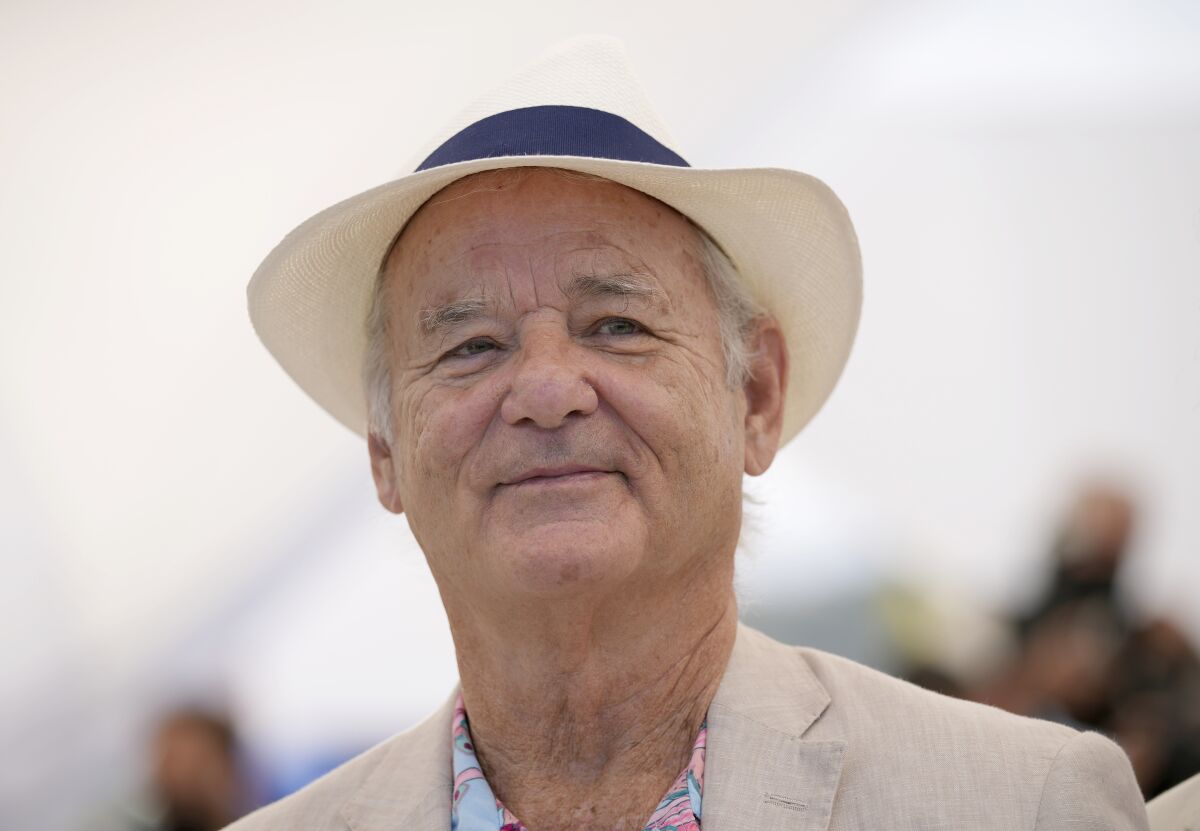 Bill Murray in a linen jacket and straw fedora.