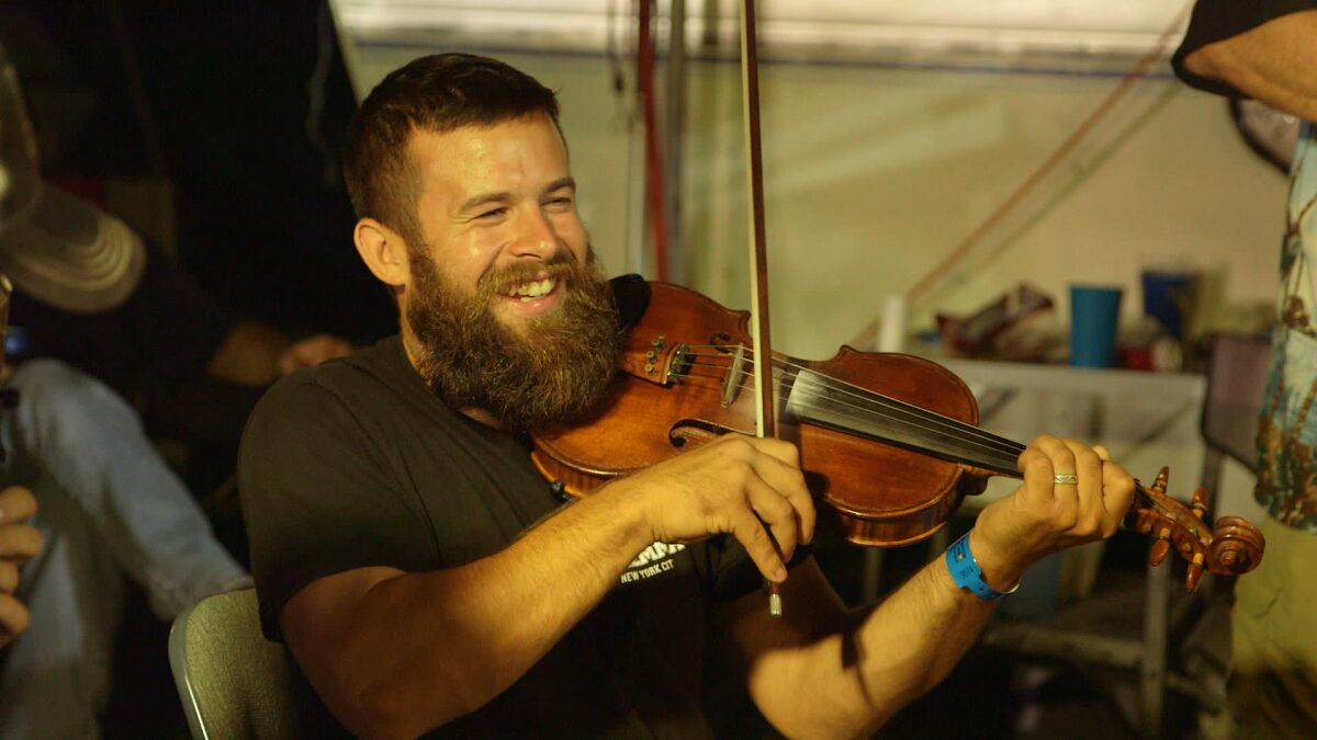 Jake Krack plays the fiddle in the documentary 'Fiddlin'