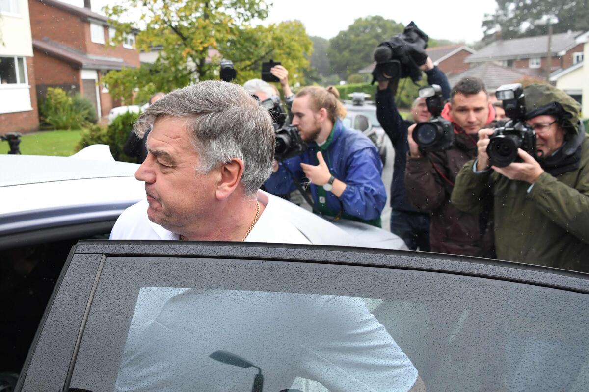 Former England manager Sam Allardyce walks out of his home in Bolton on Sept. 28. Allardyce's career as England manager came to a humiliating end following controversial comments made to undercover reporters.