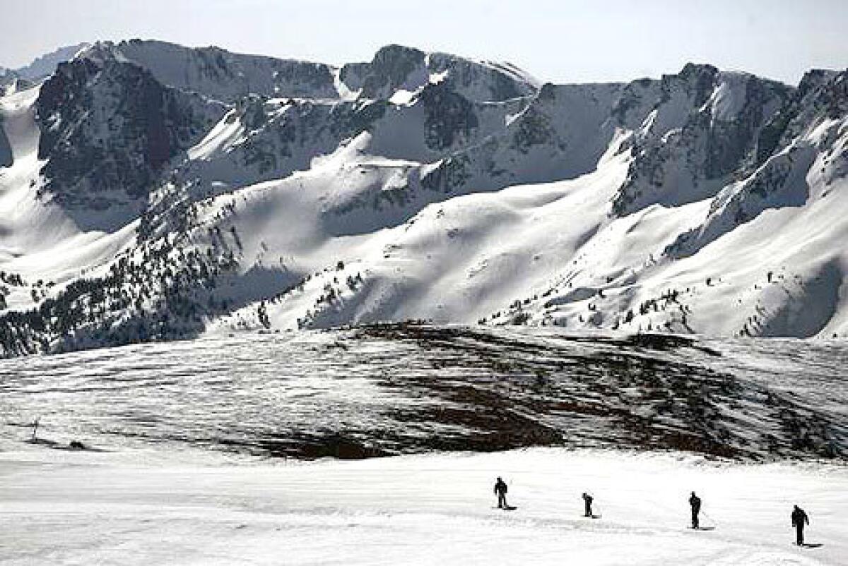 TRANQUIL SCENE: Skiers make their way across a snowfield at Mammoth Mountain resort, where a normal season sees three deaths from accidents or natural causes.