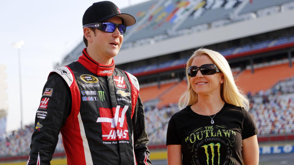 Kurt Busch, left, and Patricia Driscoll talk before qualifying at Charlotte Motor Speedway in Concord, N.C., on May 22.