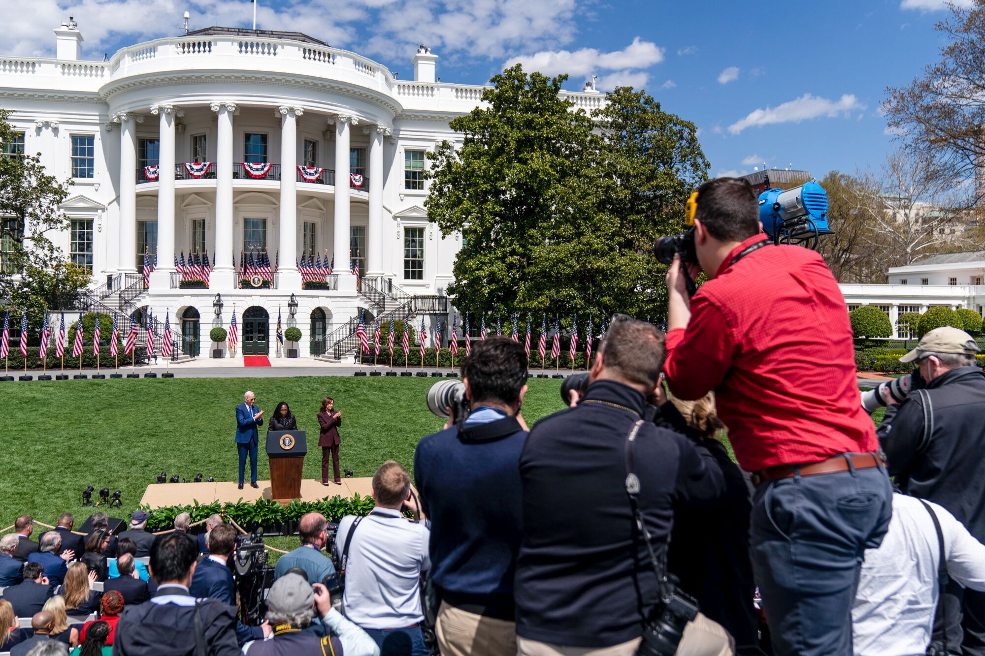 Photojournalists aim their cameras at Judge Ketanji Brown Jackson, President Biden and Vice President Kamala Harris