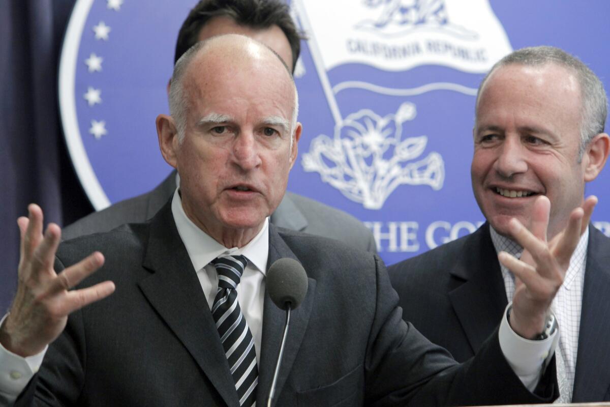 California Gov. Jerry Brown, left, and Democratic Senate President Pro Tem Darrell Steinberg hold a news conference in Los Angeles to announce pension changes.