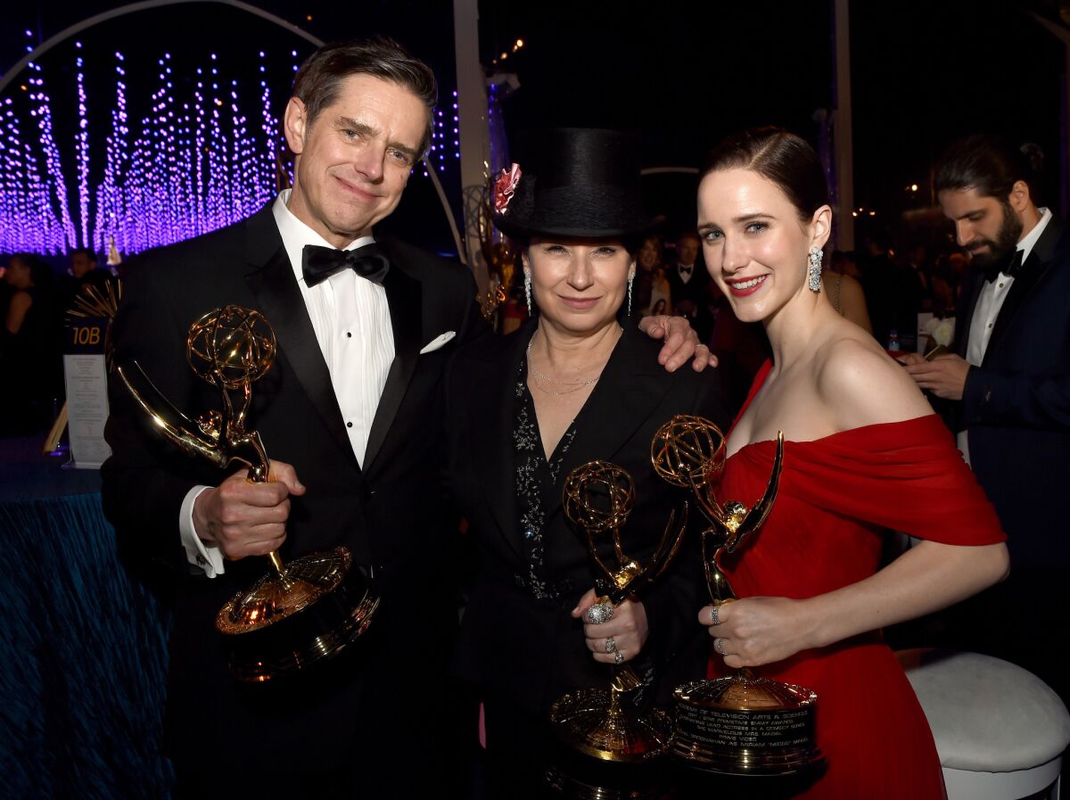 Daniel Palladino, Amy Sherman-Palladino and Rachel Brosnahan of "The Marvelous Mrs. Maisel" attend the 70th Emmy Awards Governors Ball.