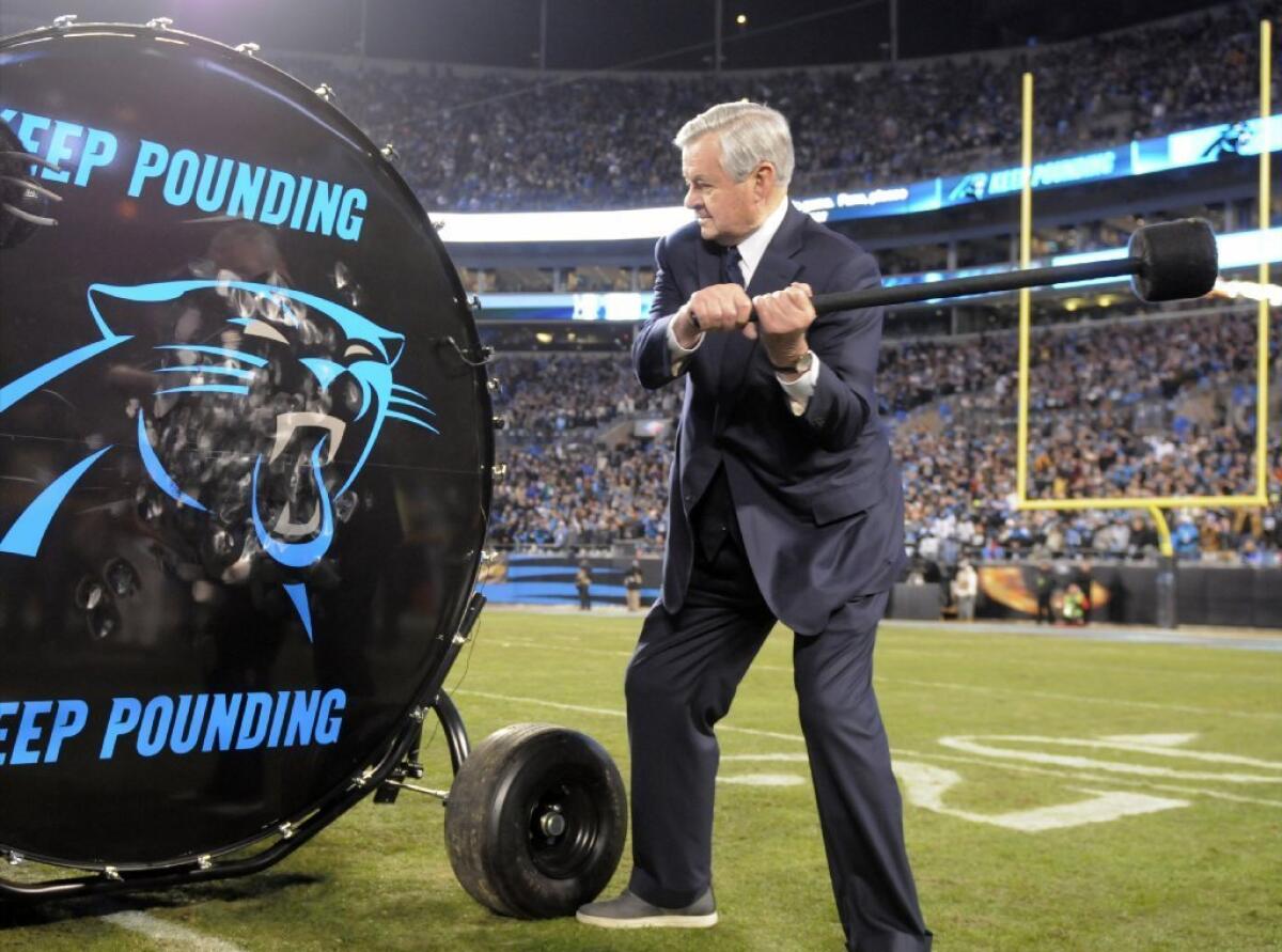 Panthers Owner Jerry Richardson hits a drum before his team's victory over the Cardinals in the NFC Championship game on Jan. 24.