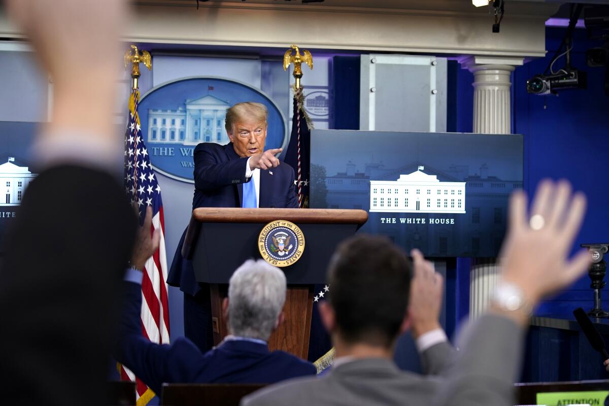 President Trump speaks during a news conference in the White House press briefing room Wednesday.