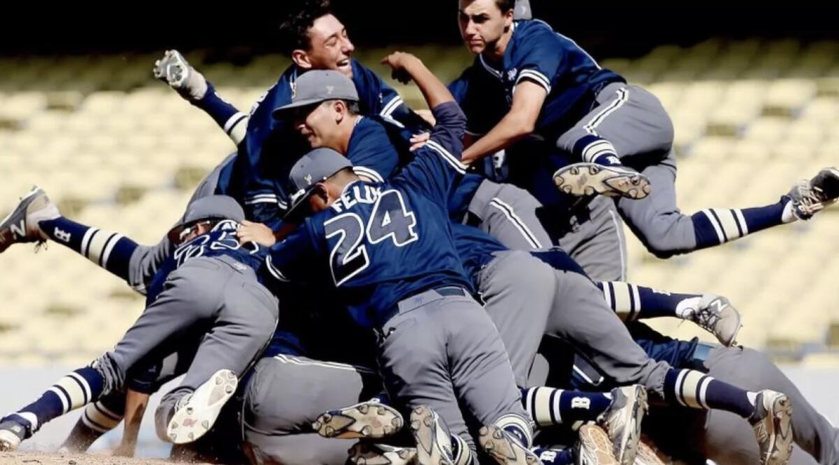 Birmingham players celebrate at Dodger Stadium in a 2017 City Section final.