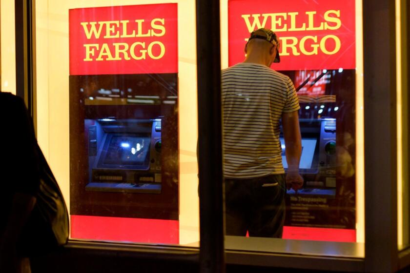 A customer uses a Wells Fargo ATM in New York in 2016.
