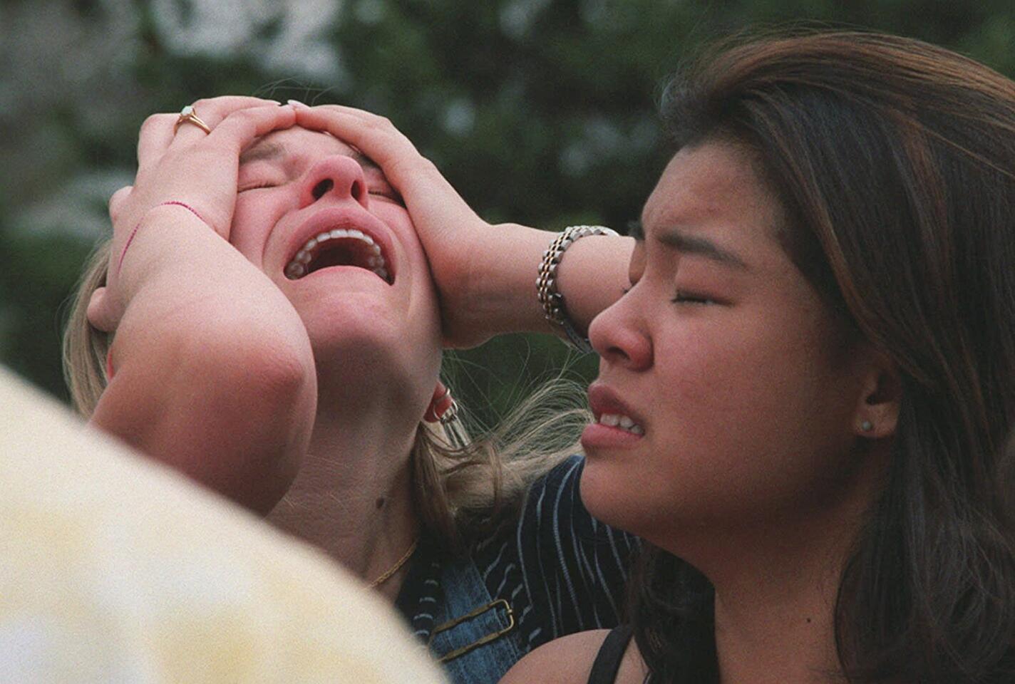Columbine High School students react at a triage site near the school in Littleton, Colo., after the shooting April 20, 1999.