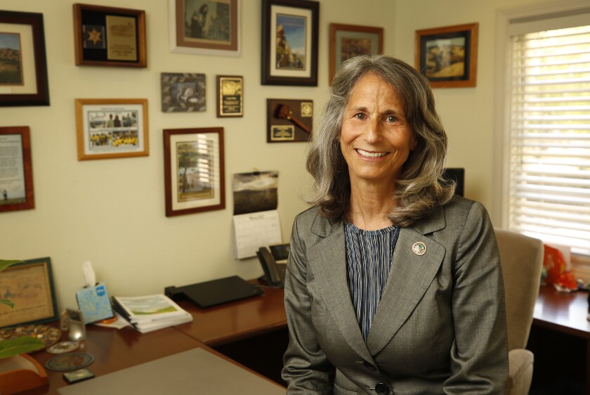 Ventura County Supervisor Linda Parks is shown at her desk.