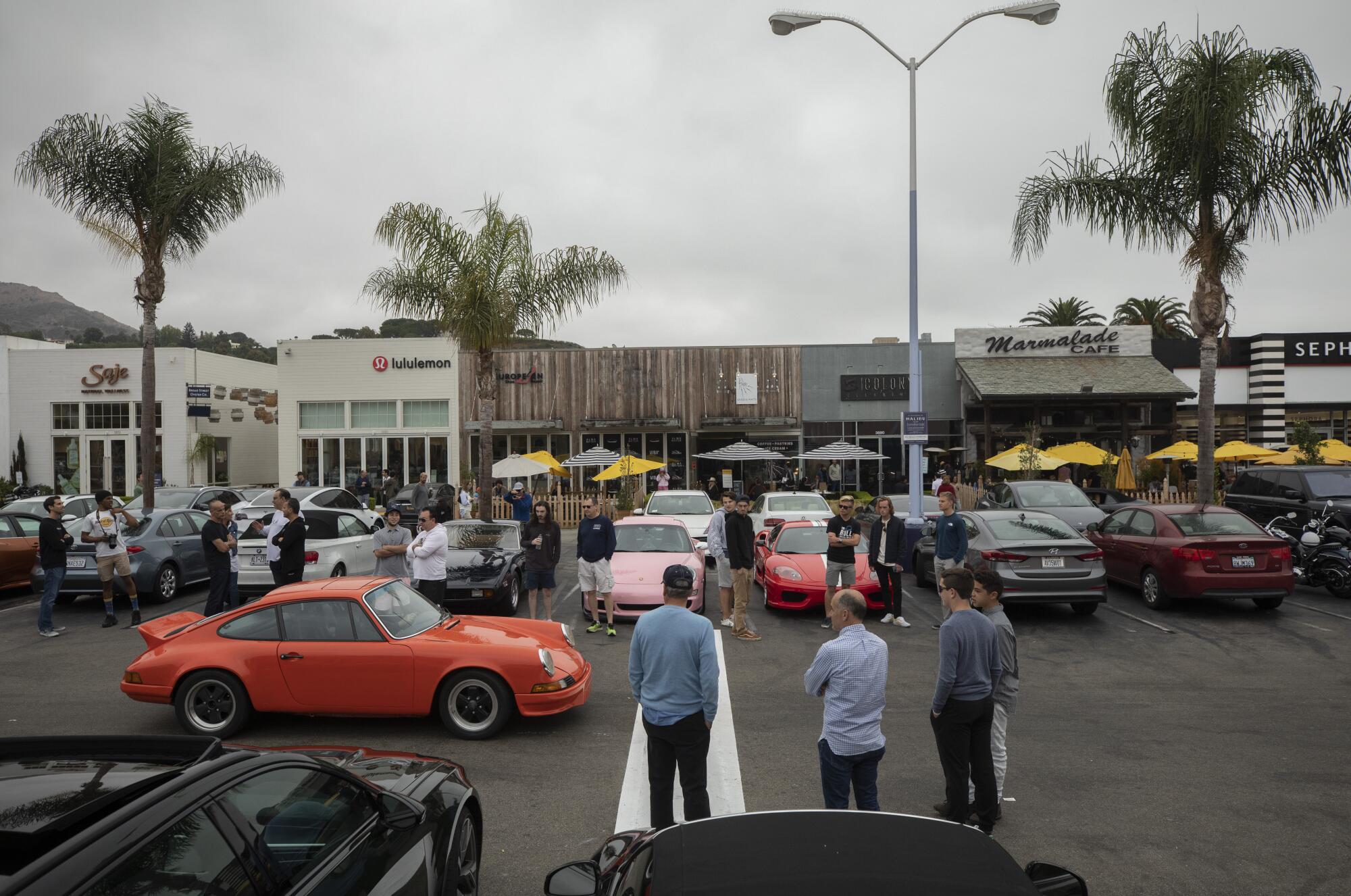 Auto enthusiasts gather at the Malibu Village Shopping Mall on Sept. 26.