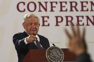 Mexico's President Andres Manuel Lopez Obrador calls on a journalist during his daily press conference at the National Palace, in Mexico City, Wednesday, June 22, 2022. (AP Photo/Marco Ugarte)